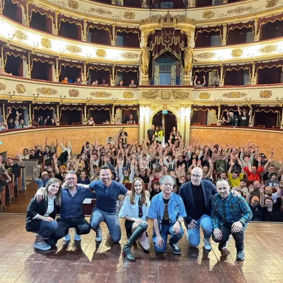 Audience filling a historic Italian theatre at a Japanese culture event